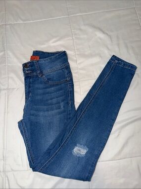 Wax Jean Medium Blue Skinny Jeans with Subtle Distress
